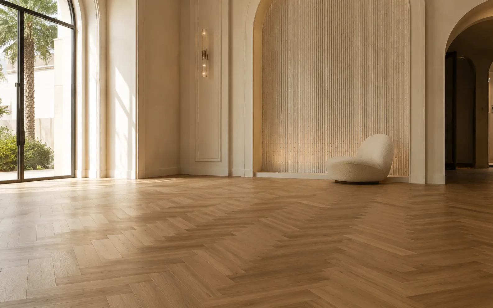 A Jeddah villa reception in herringbone oak under raking daylight