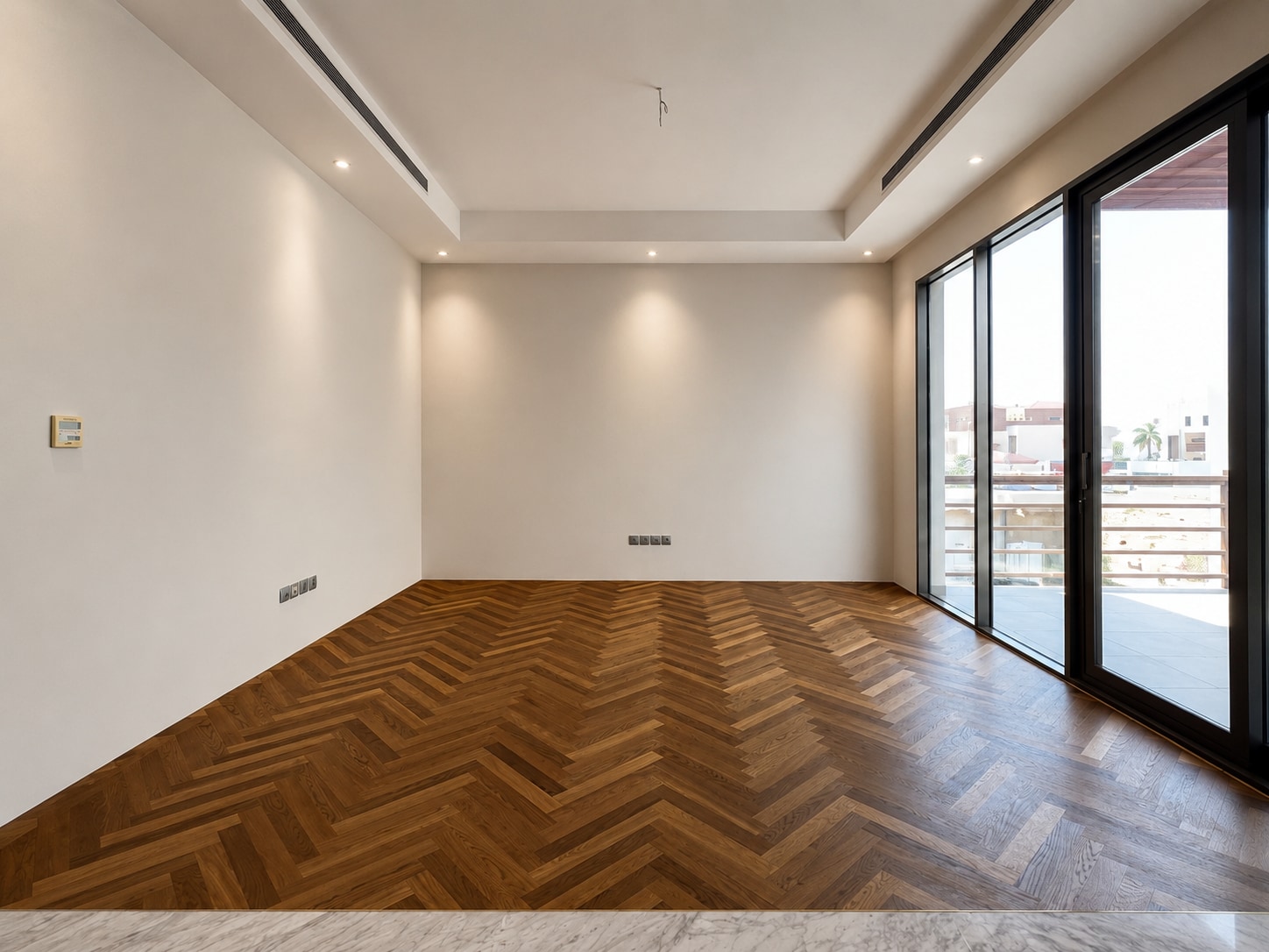 After — the same room completed in warm herringbone
