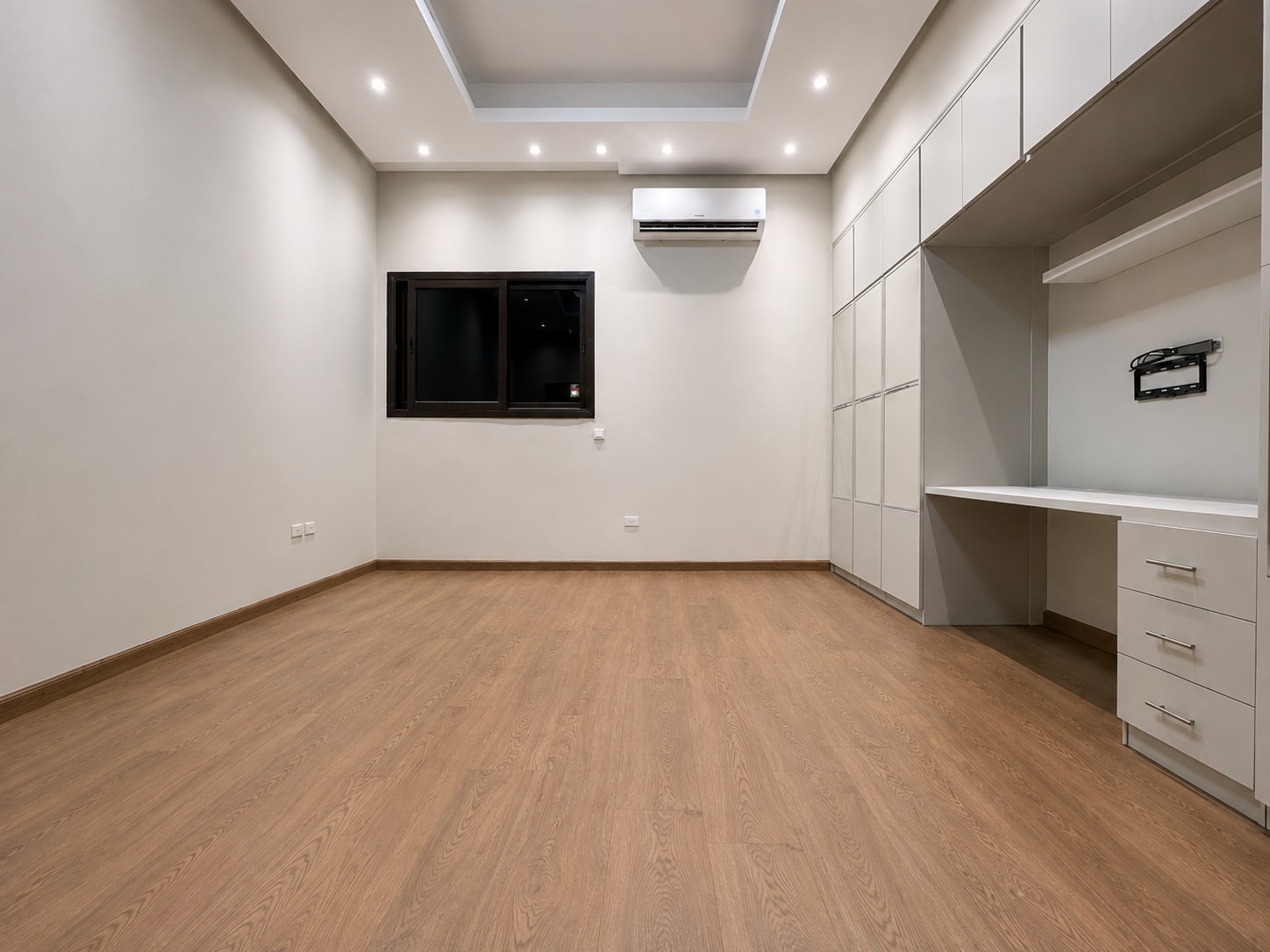 After — the same fitted room completed in warm oak