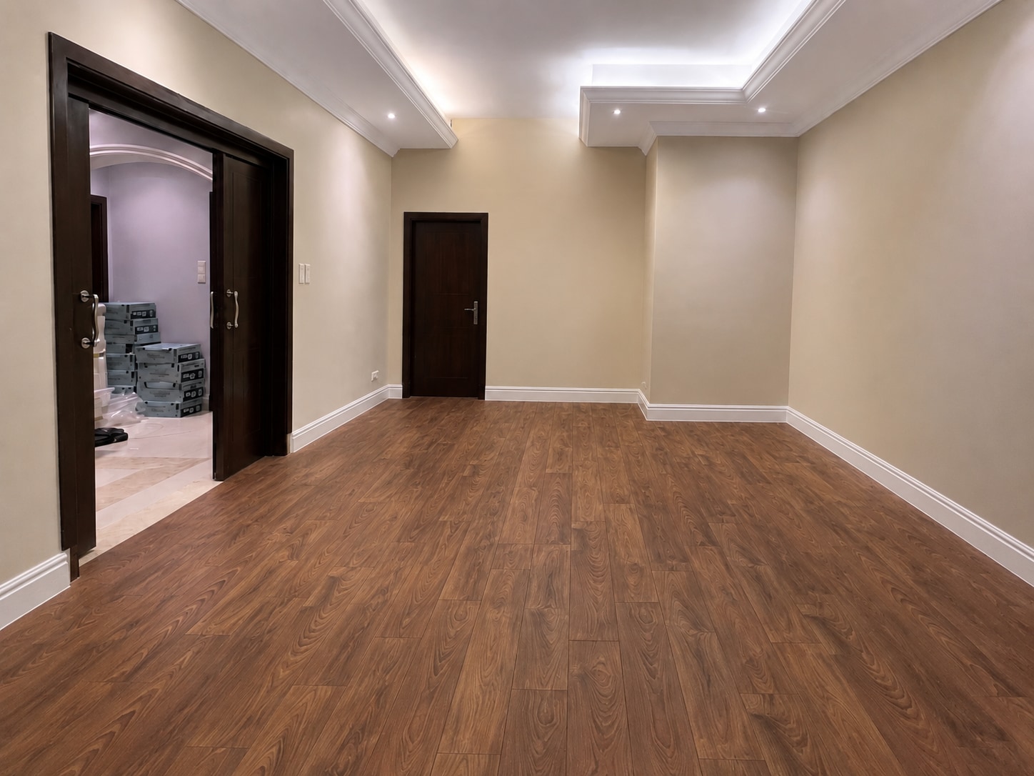 After — the same room completed in warm straight-plank oak