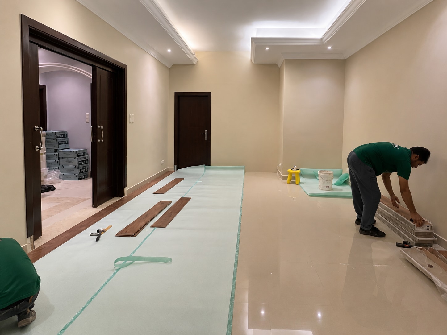 Before — the polished stone room immediately before the warm oak installation