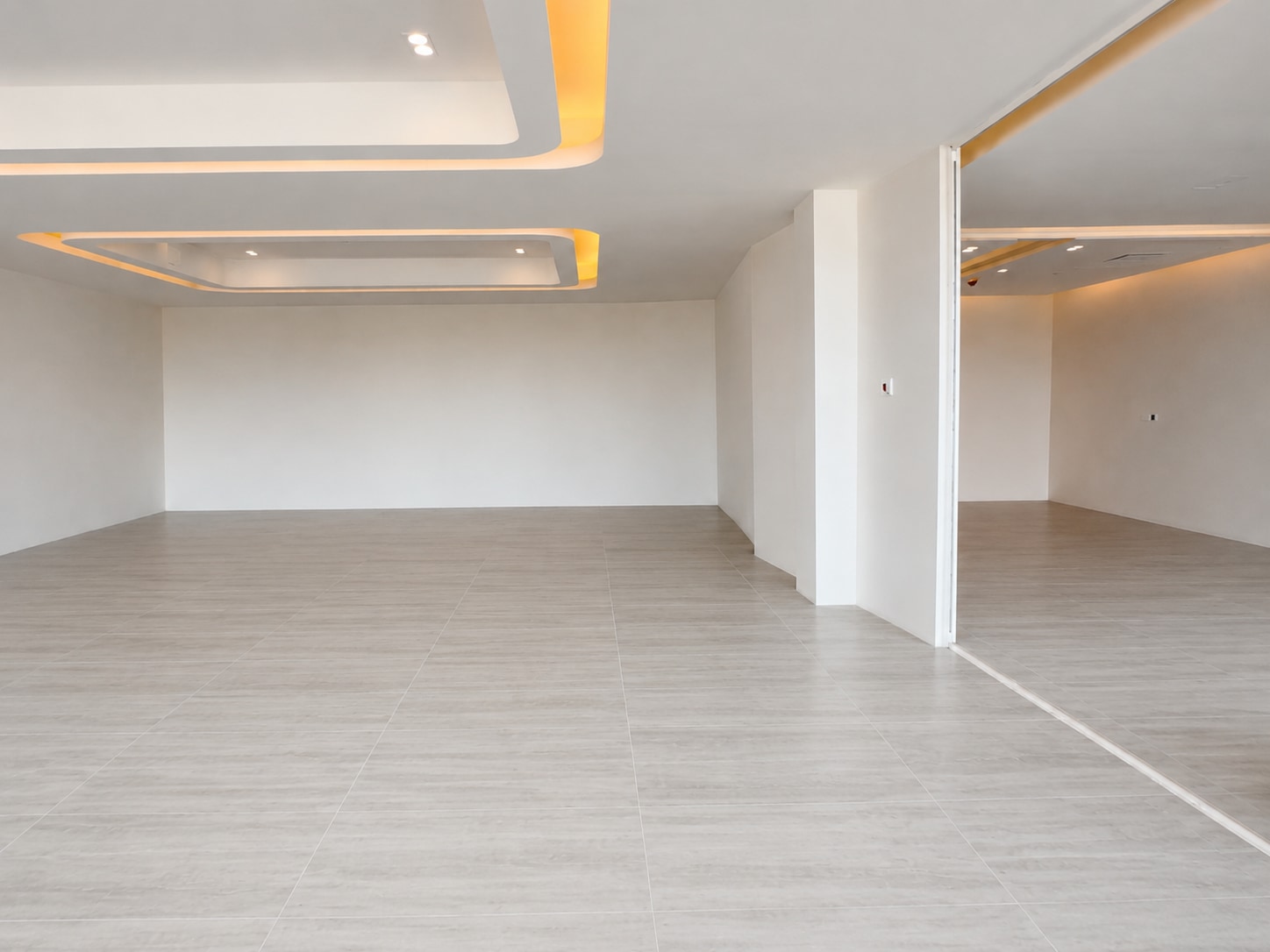 After — the same workplace completed in a calm light-grey plank finish