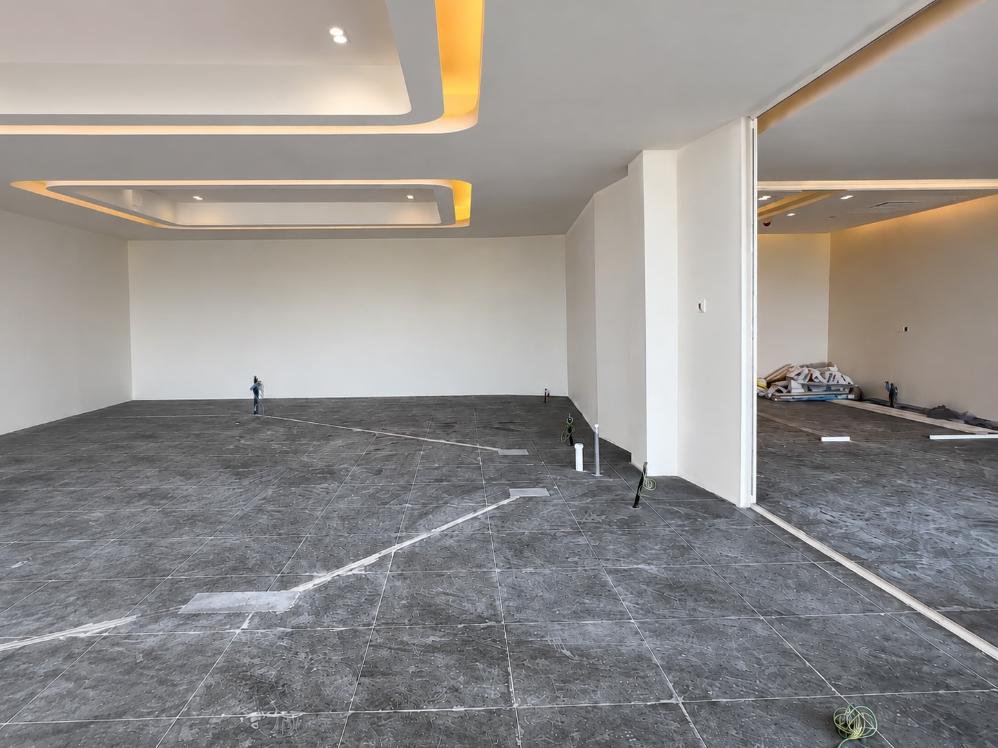 Before — the open workplace floor prior to its light wood-look finish