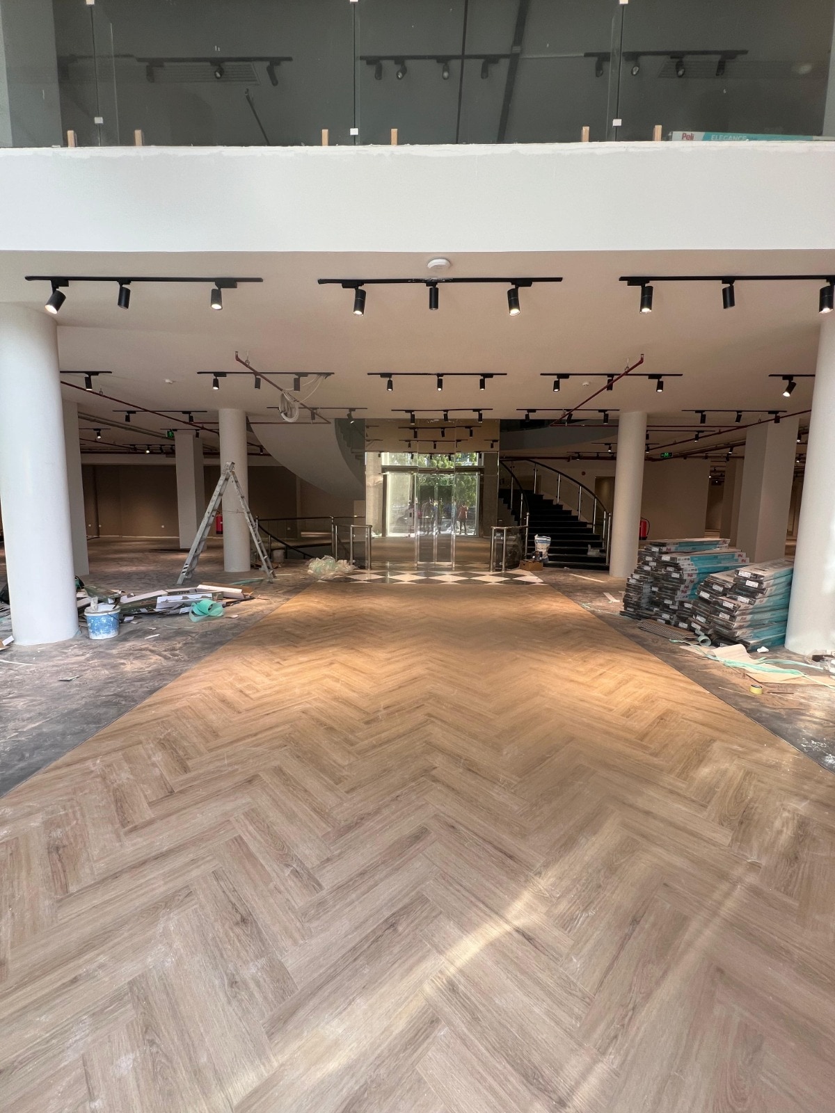 The completed herringbone floor carrying the length of a grand hall