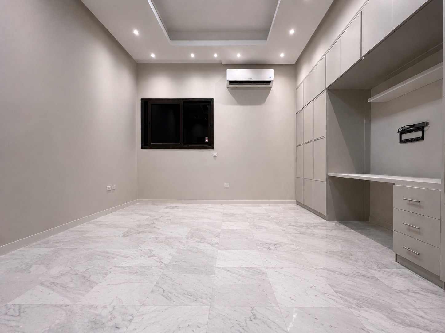 Before — the fitted private room in pale stone