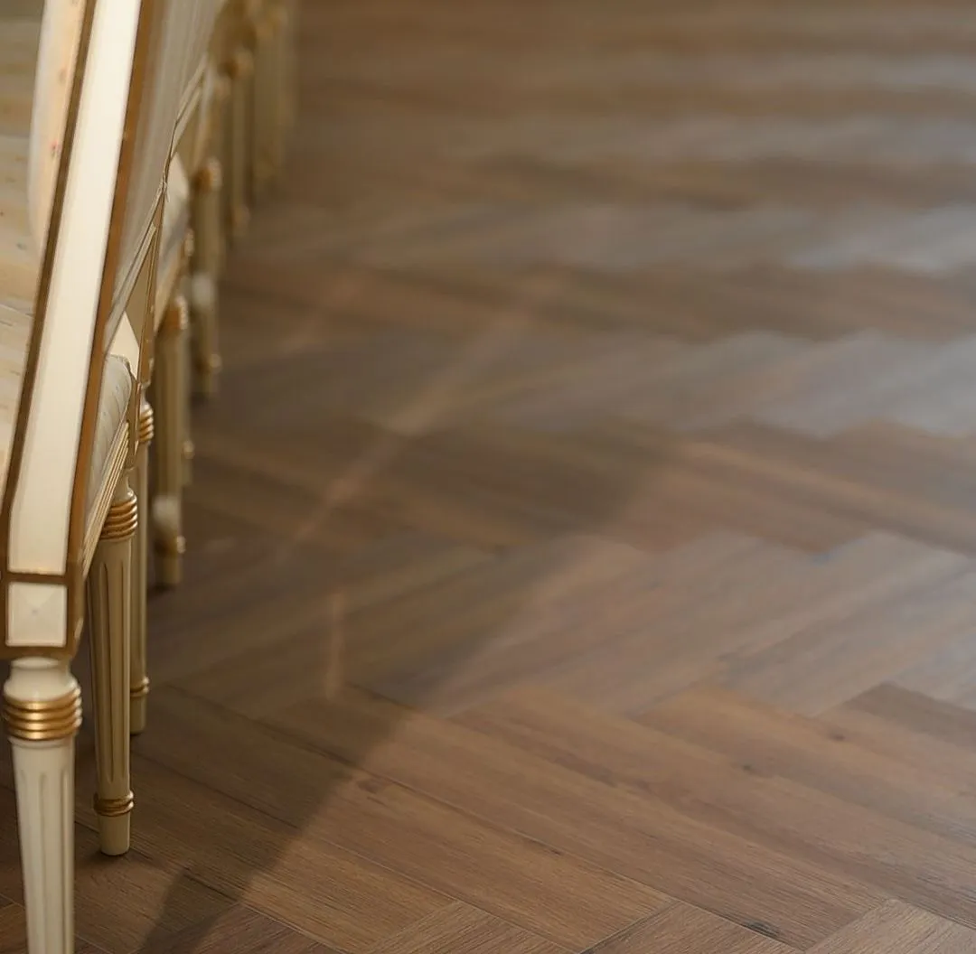 Herringbone oak carrying the depth of a long room