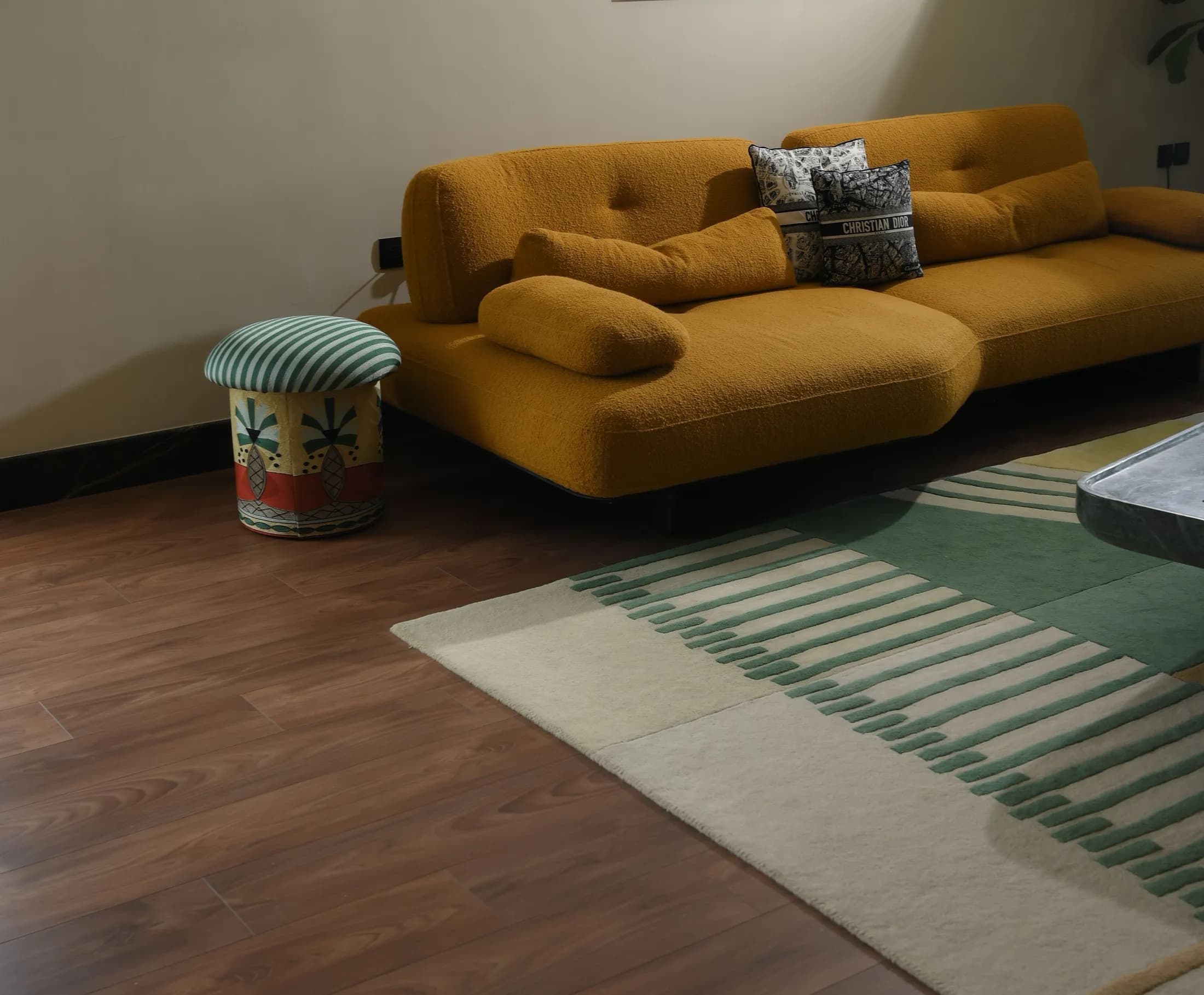 A living room floored in warm herringbone oak