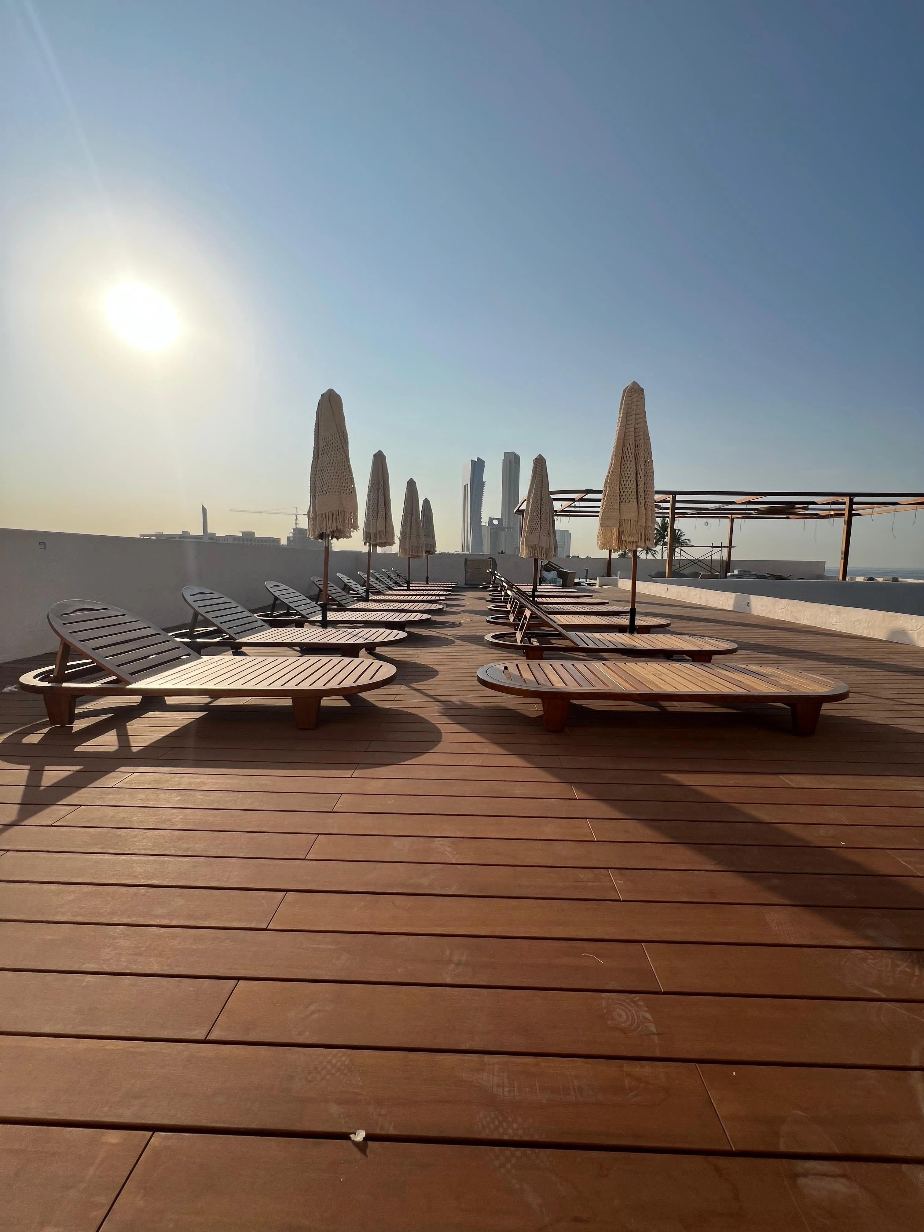 Low evening light falling across the completed outdoor deck