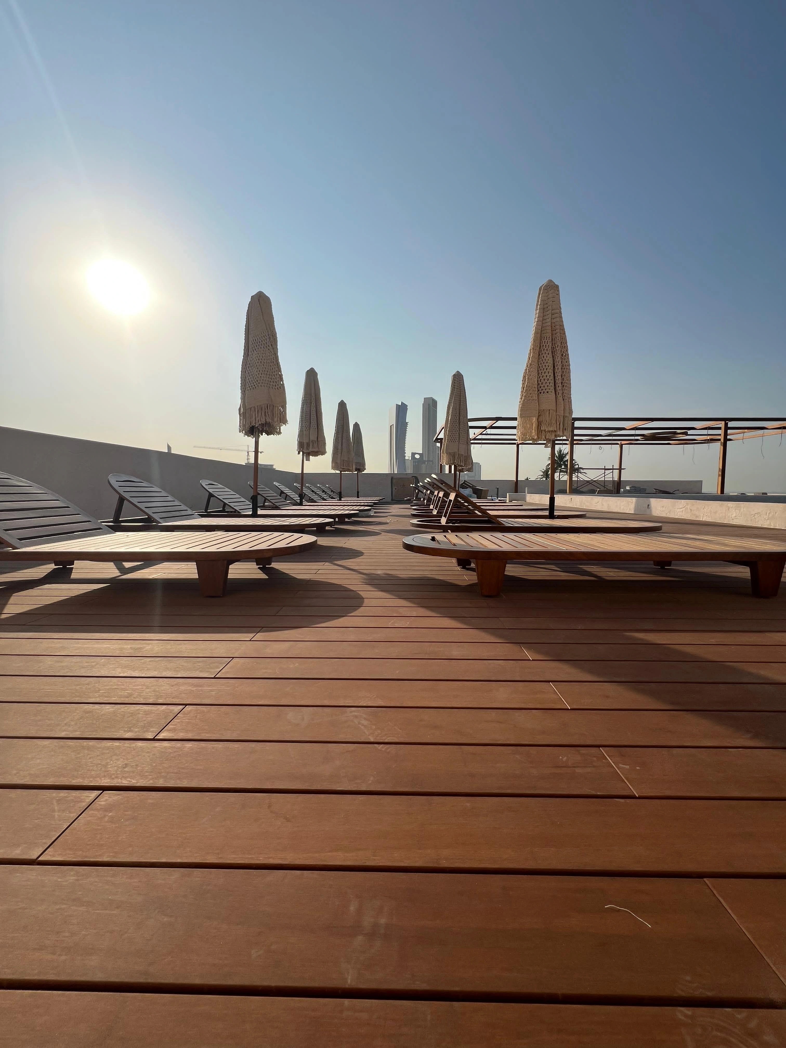 Low view across the finished waterfront deck at sunset